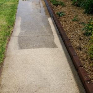 Pressure washed sidewalk before & during